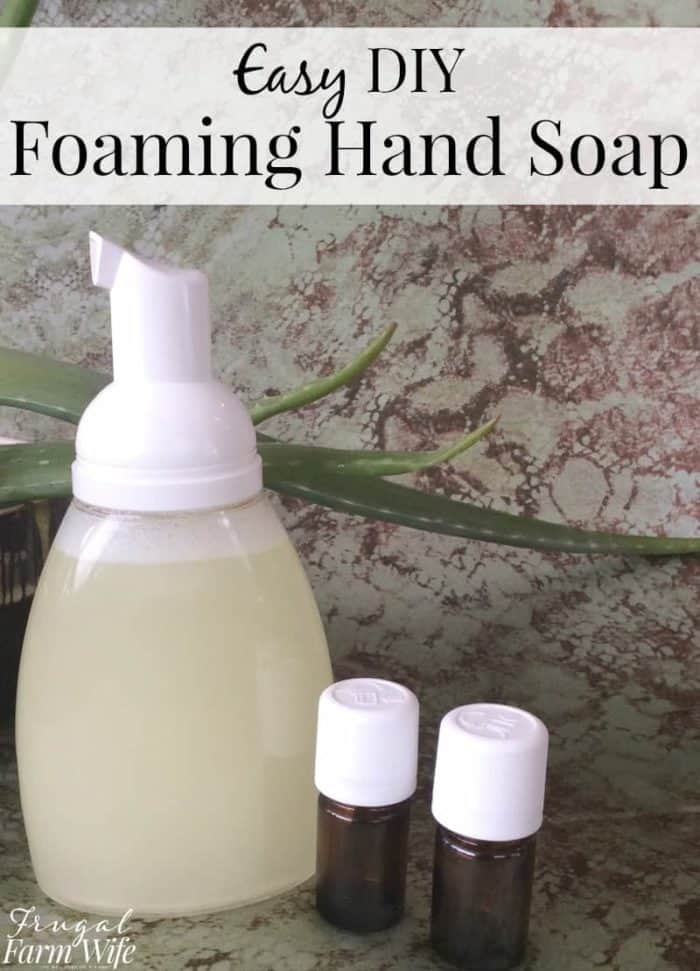 This picture shows a hand soap container sitting on a counter with text that reads "Easy DIY Foaming Hand Soap"