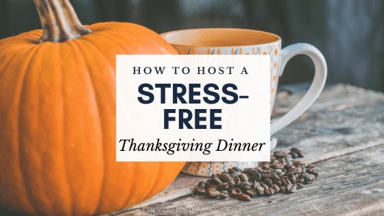 Image shows a pumpkin sitting on a table next to a coffee mug, with text that reads "How to host a stress-free Thanksgiving dinner"