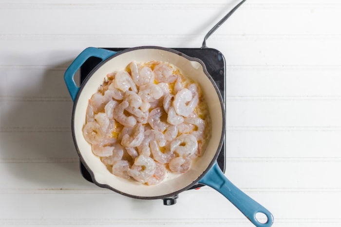 shrimp sauteing in butter and shallots