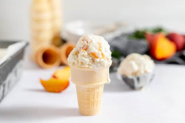 peach cobbler ice cream served in a cone