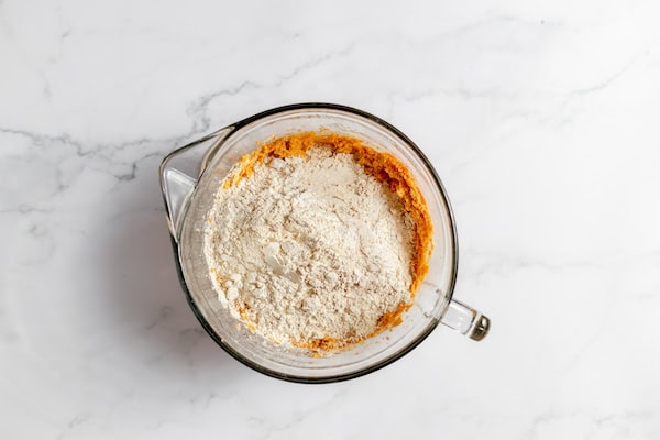 Photo, taken from above, shows a mixing bowl with wet and dry ingredients together