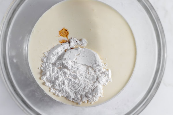 whipped cream ingredients in a bowl