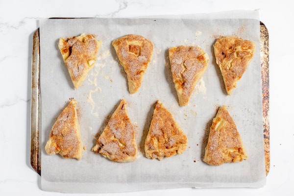 baked apple scones with cinnamon sugar on them
