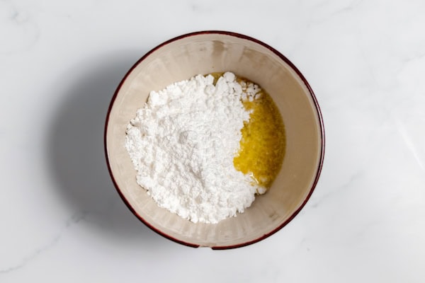 ingredients for maple icing in a bowl
