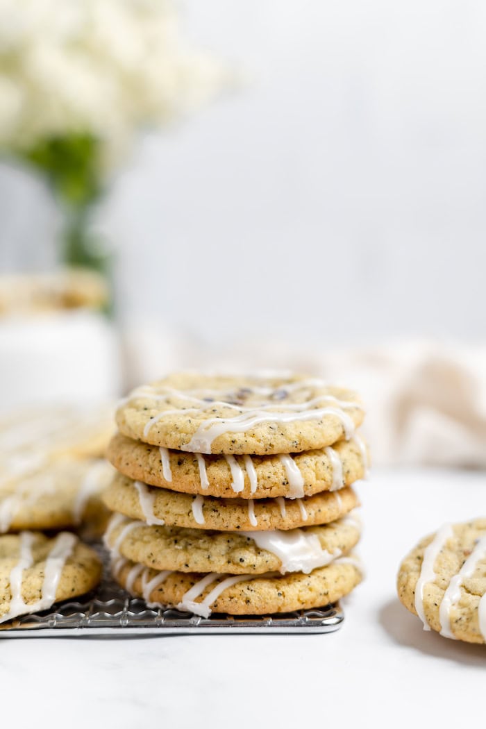 Image shows a stack of Earl Grey cookies on a cooling rack on a table