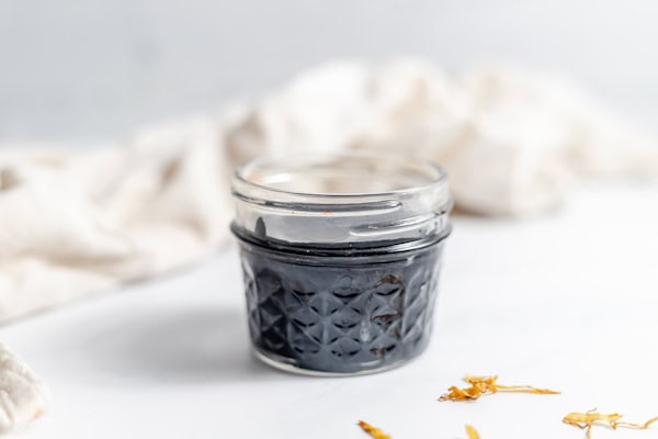 jar of drawing salve on a table