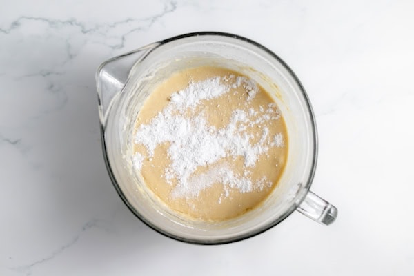 sprinkling baking soda on top of pancake batter before mixing it in