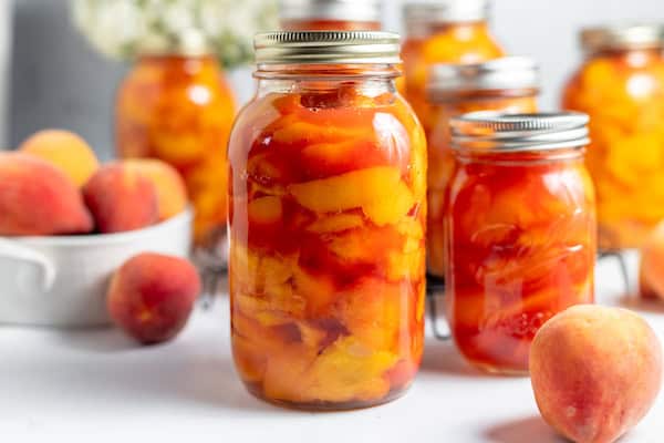 canned peaches on a table