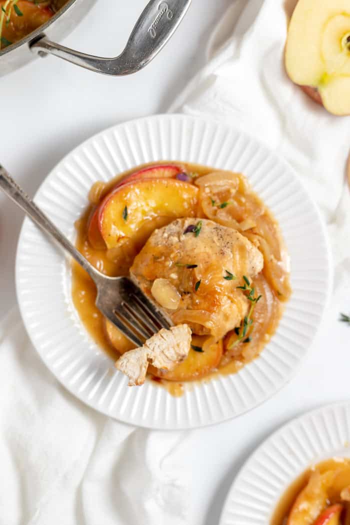 plate of apple cider chicken with a bite cut off