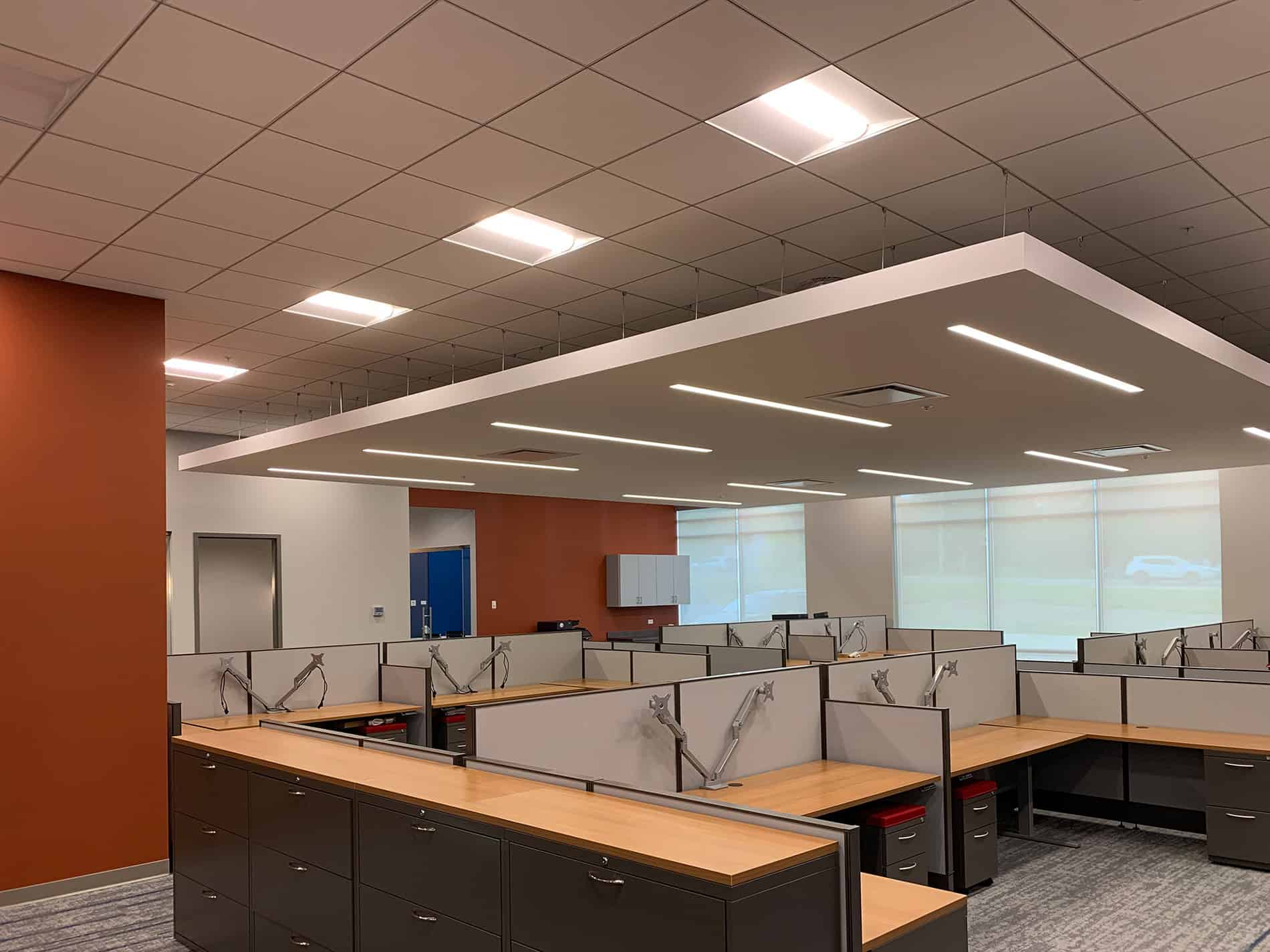 CODA's new office area has cubicles and workspaces in a modern setting.