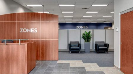 The lobby of a new office building. The sign behind reception says, "Zones." Keeley Construction handled the renovation and construction of this facility.