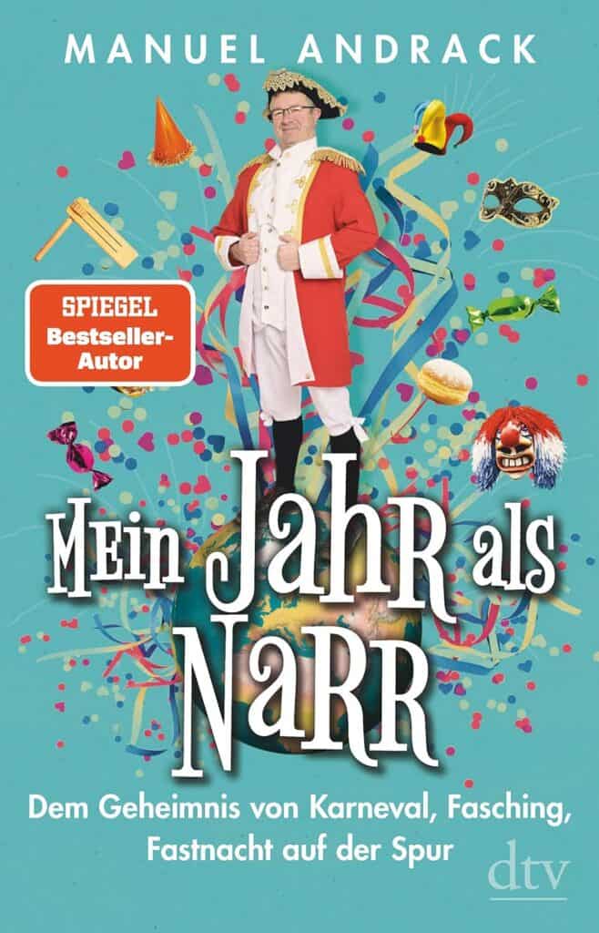 Der Mann in Karnevalskostüm mit bunten Dekorationen und Masken, passend zum Kölner Karneval.