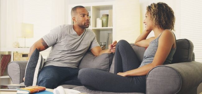 Picture of couple in conversation - sti symptoms
