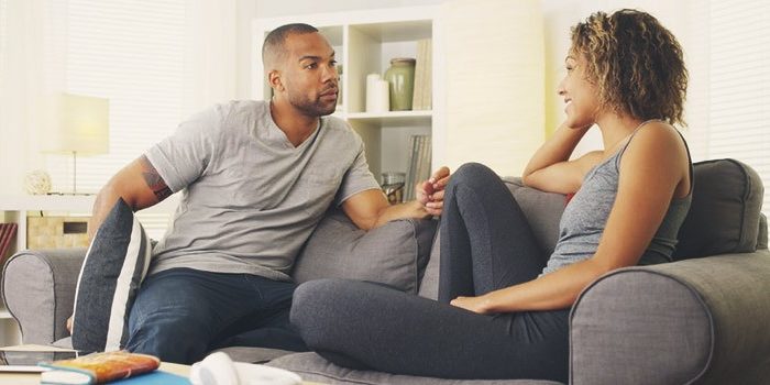 Picture of couple in conversation - sti symptoms