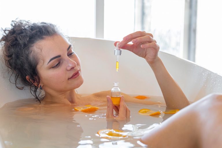 lady in the bath with aromatherapy oil