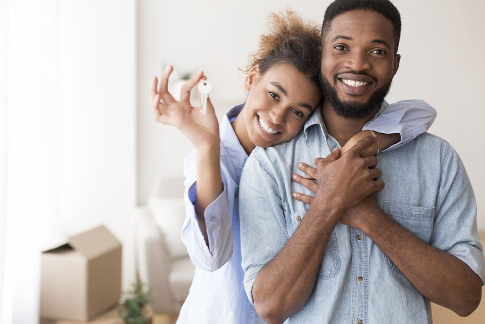 Couple Buying Home and Holding Keys