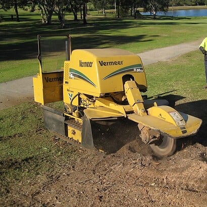 stump removal conducted by priority trees with man using machine