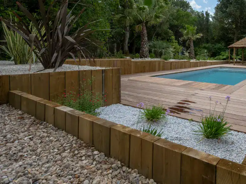 Fixation de traverses en bois sur sol pose