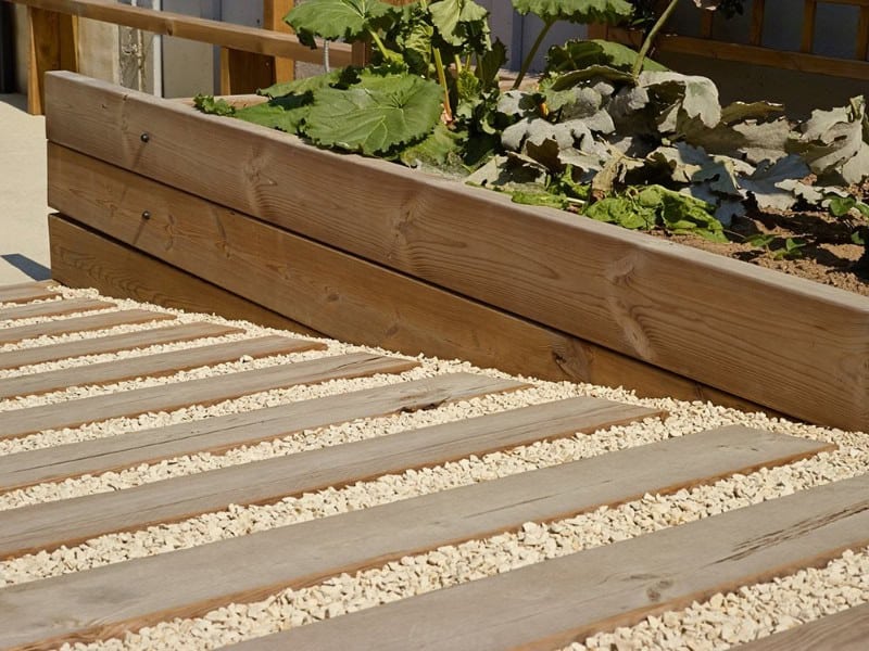 Fixation de traverses en bois sur sol