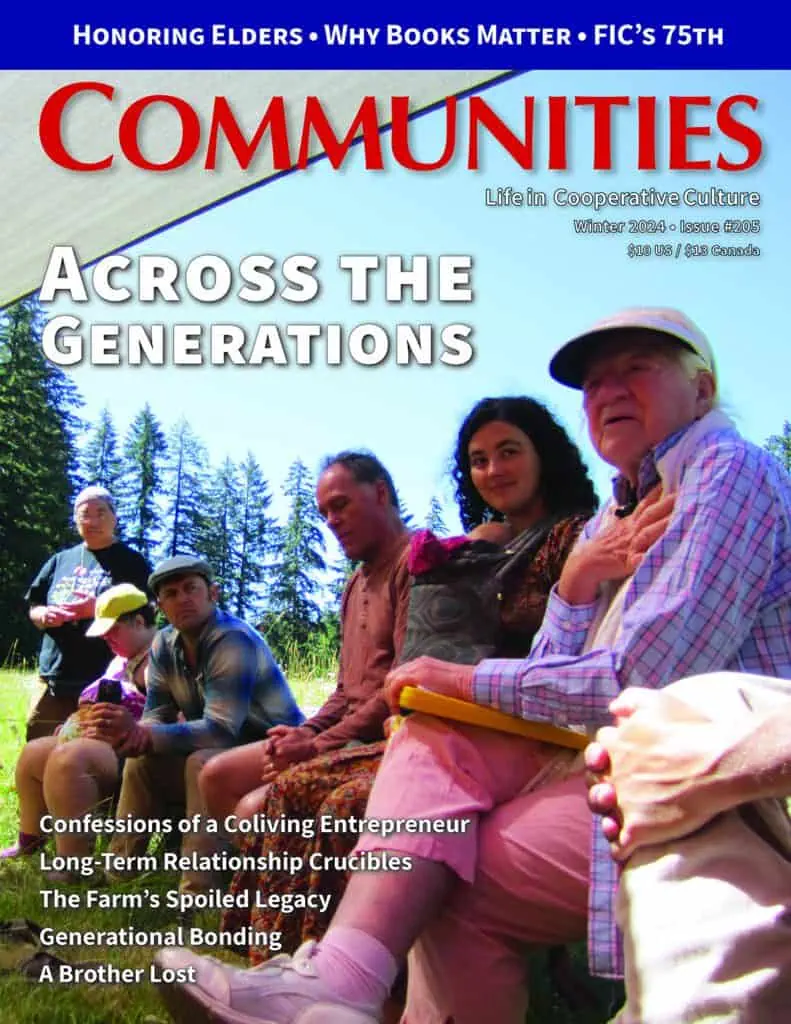 Group of elders and young adults outdoors in a forest setting.
