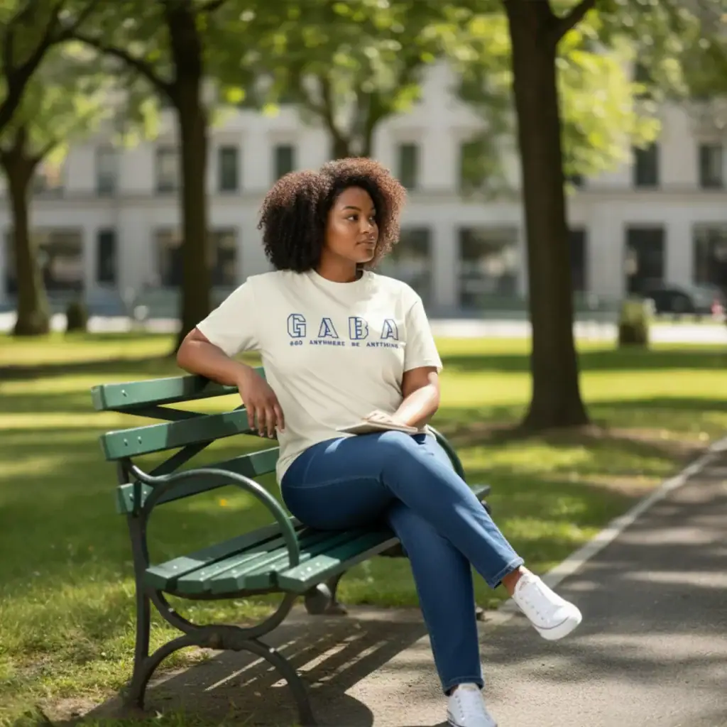 Woman wearing GABA x JACK&JONES small monkey T-shirt in park.