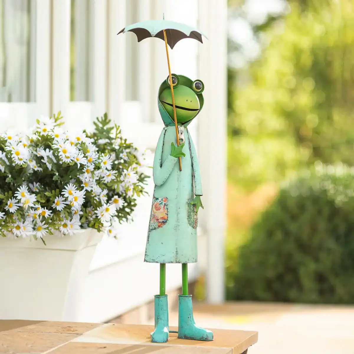 green metal storybook frog metal sculpture