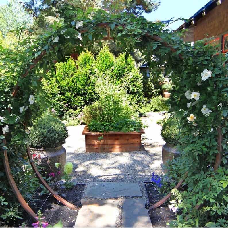 Gracie moon gate trellis with flowering vine