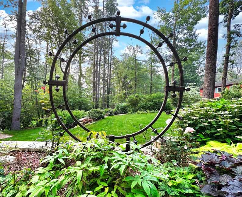 iron moongate trellis in garden