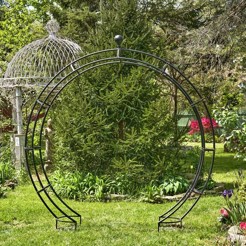 iron moon gate trellis with plant stands