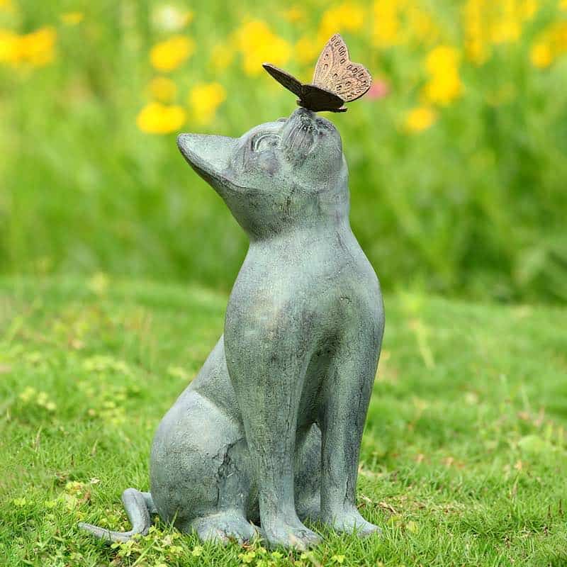 aluminun cat statue with a butterfly on her nose