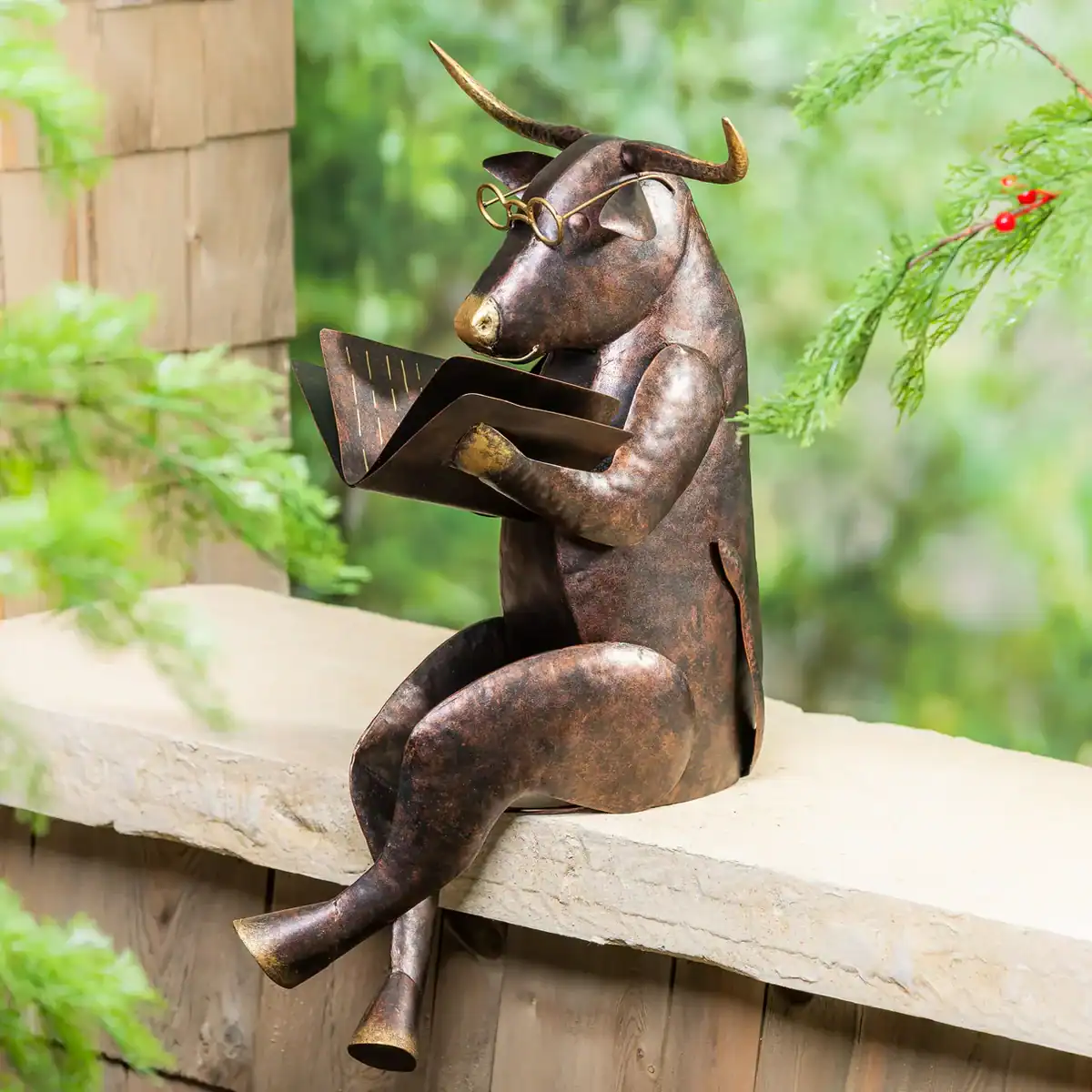 reading cow statue