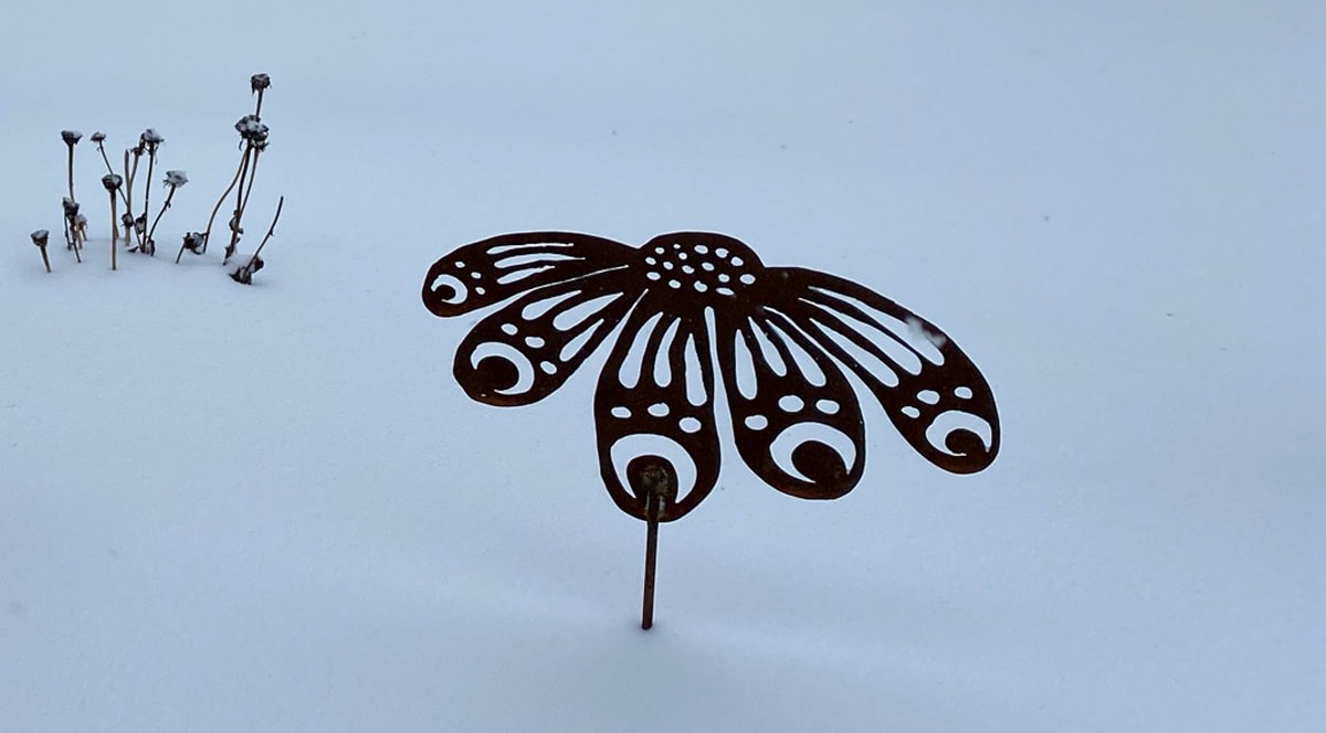metal garden art in the snow