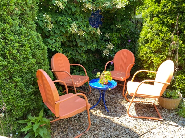 seating area with four red chairs