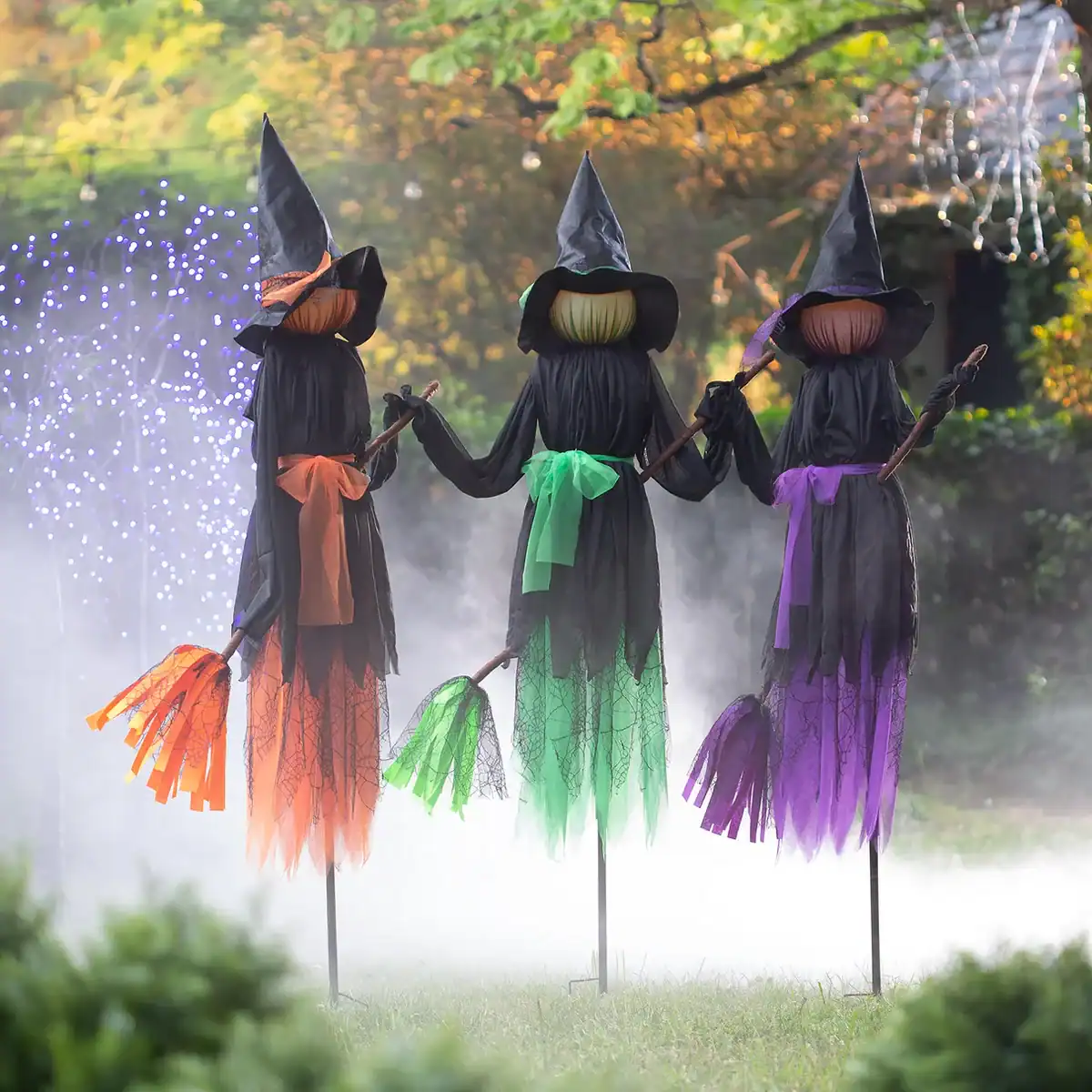 3 lighted witch stakes with brooms