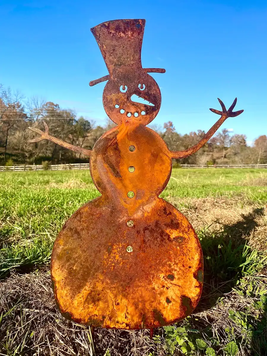 rusted steel snowman garden stake