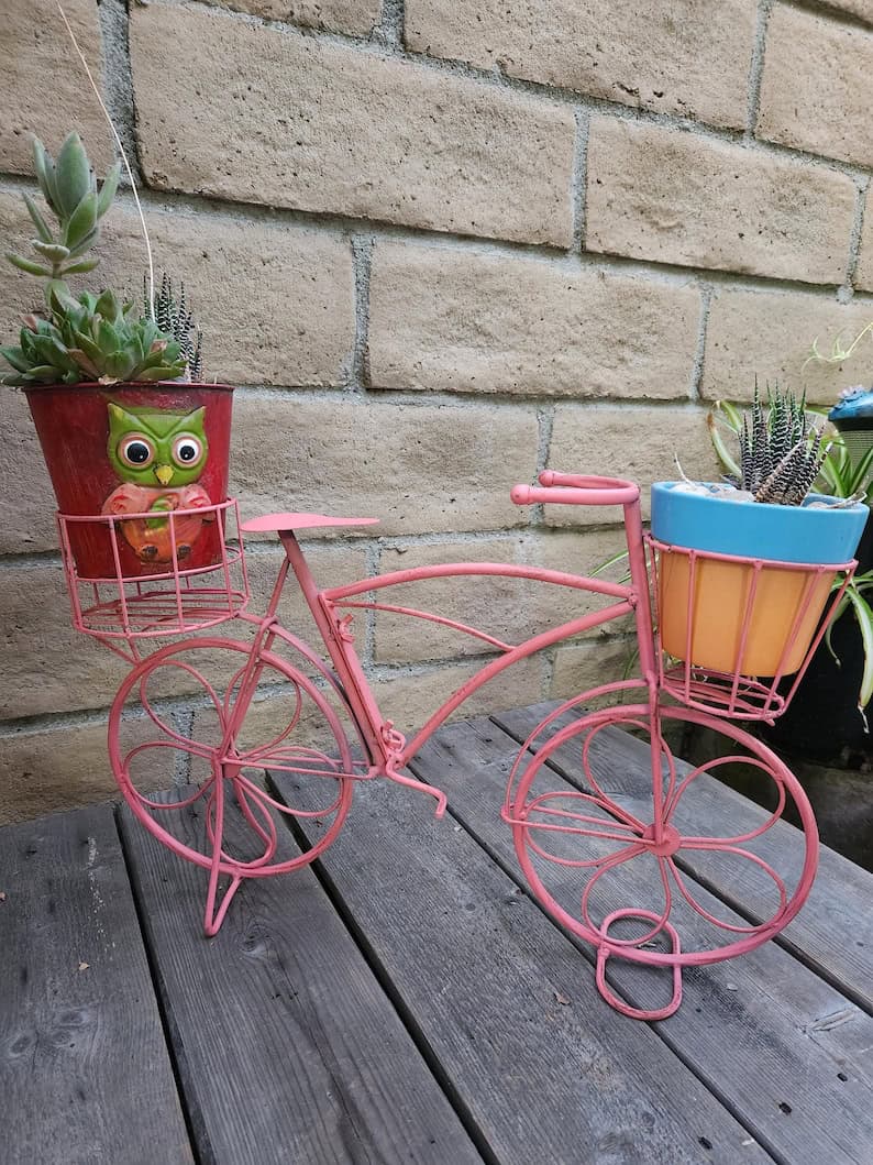 pink metal bicycle planter
