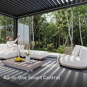 Elegant sunroom with glass walls and outdoor greenery.