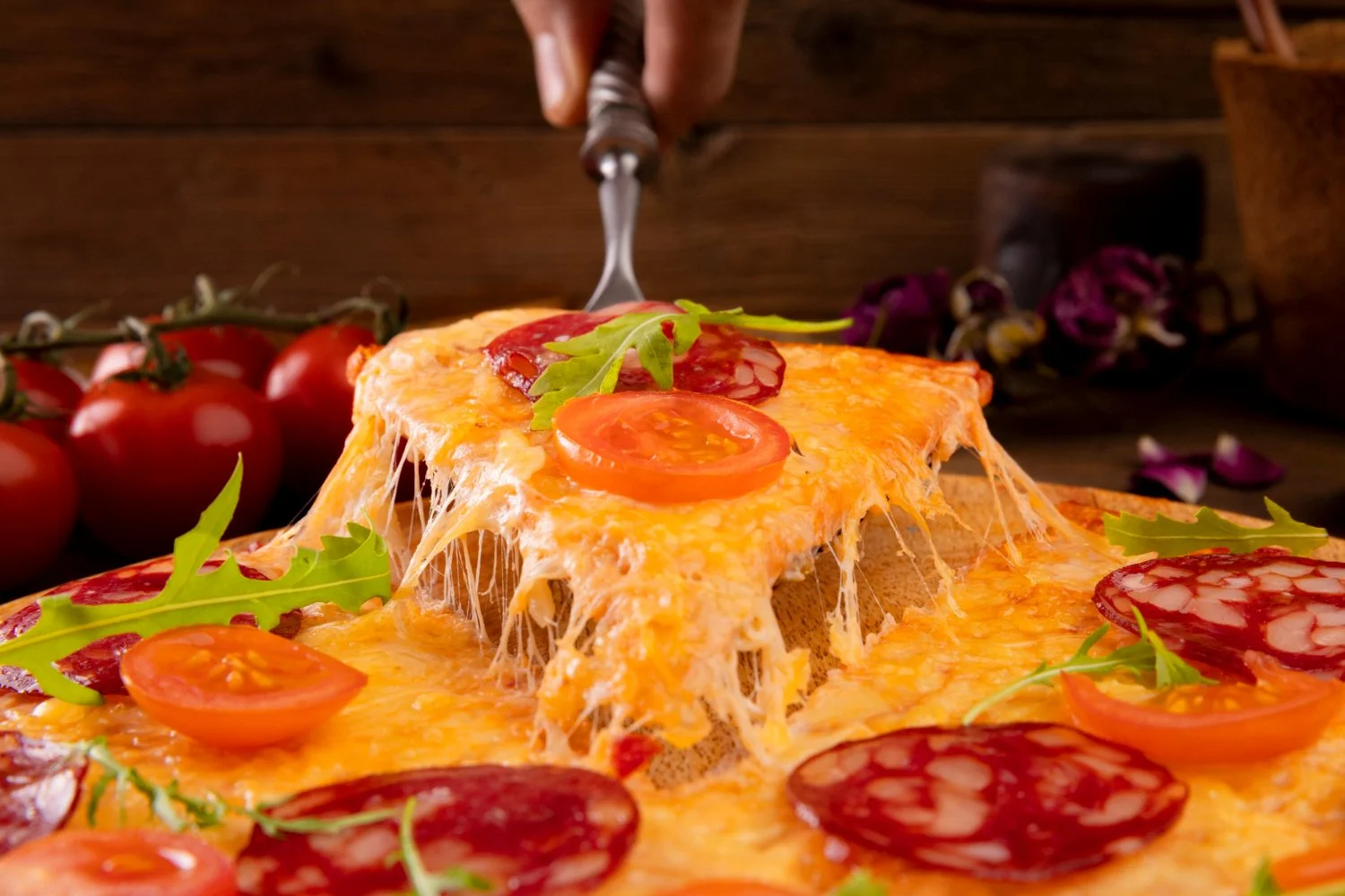 A Beautifully Layered Pizza With Melted Cheese, Colorful Toppings, And A Golden