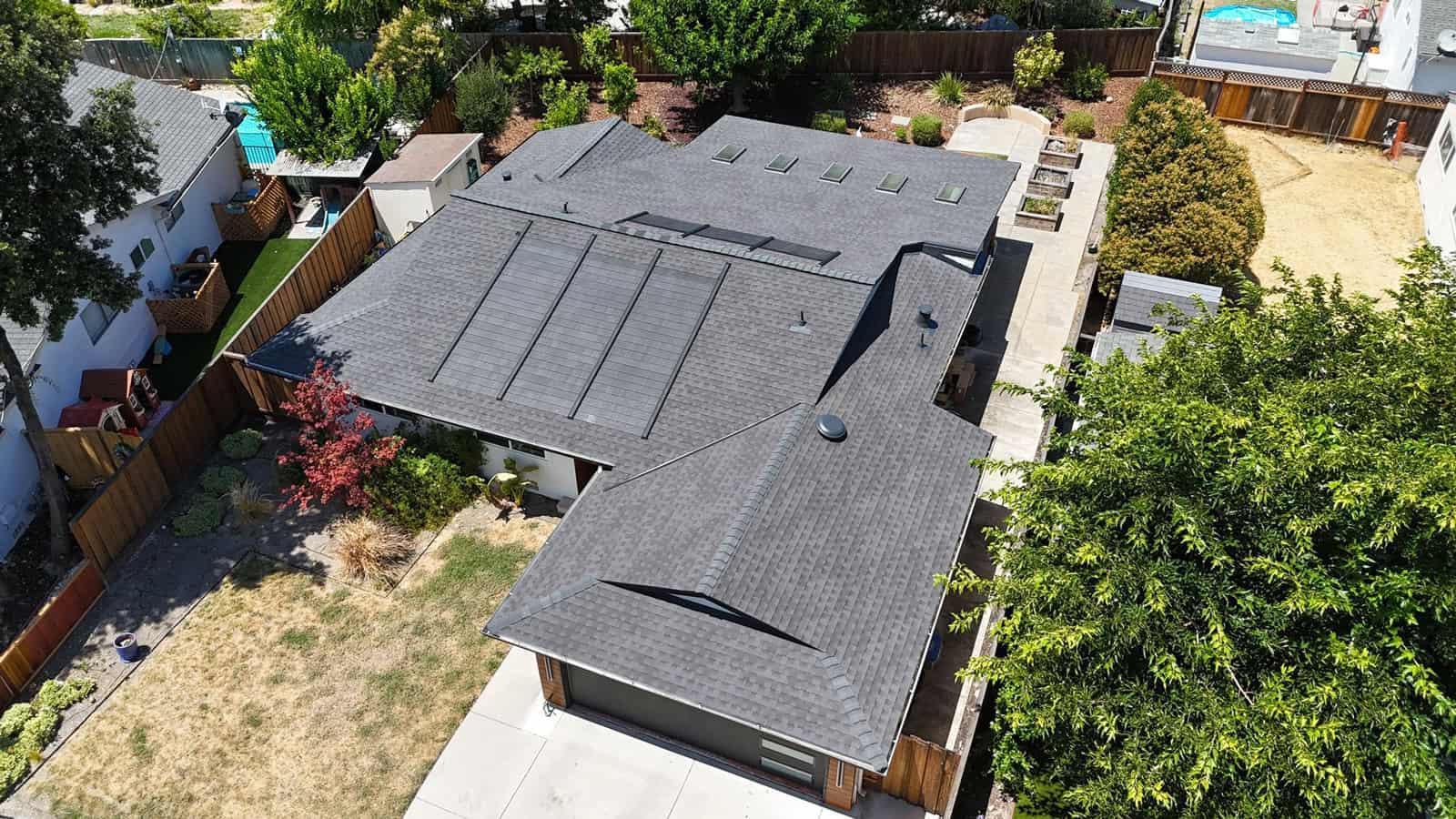 Completed shingle and solar roof installation on Ocho Rios Dr in San Jose by ELM Roofing.