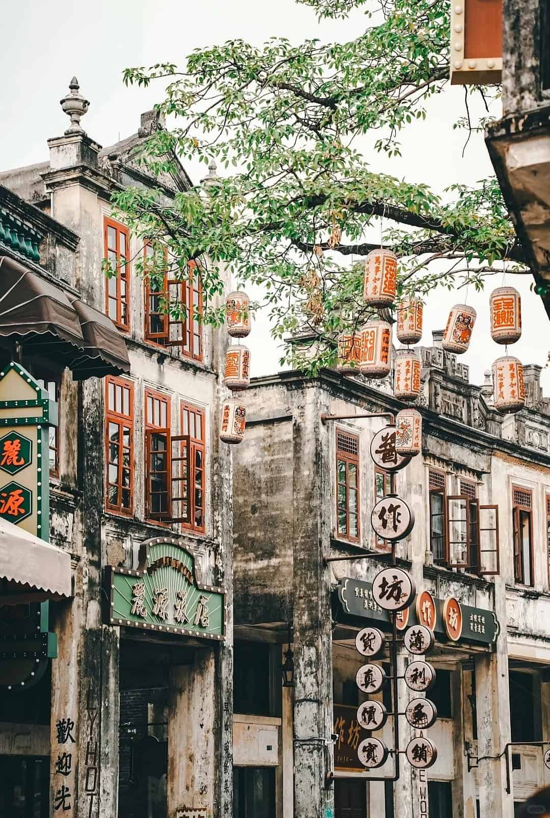 Street view of Chikan Old Town in Wuyi, Guangdong, showcasing preserved traditional architecture and lanterns, representing the cultural legacy of the Guangdong Five Counties diaspora.