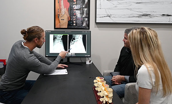 Paul explaining x-rays to patients