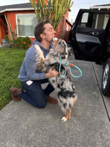 Heartwarming reunion between Finn, a transported dog, and his owner after traveling from the UK to the USA.