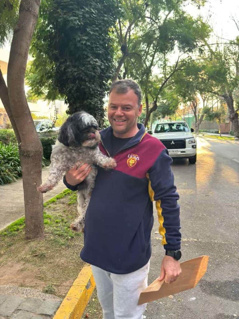 Elvis, a dog, with his owner in Chile