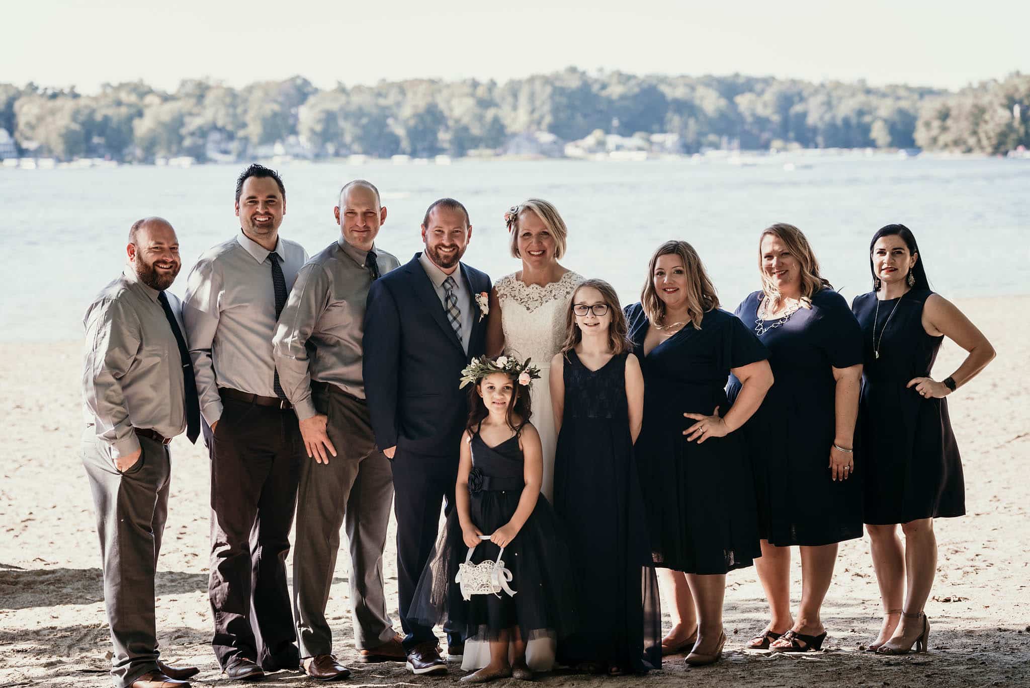 Bridal party cheering on beach at Pokagon State Park