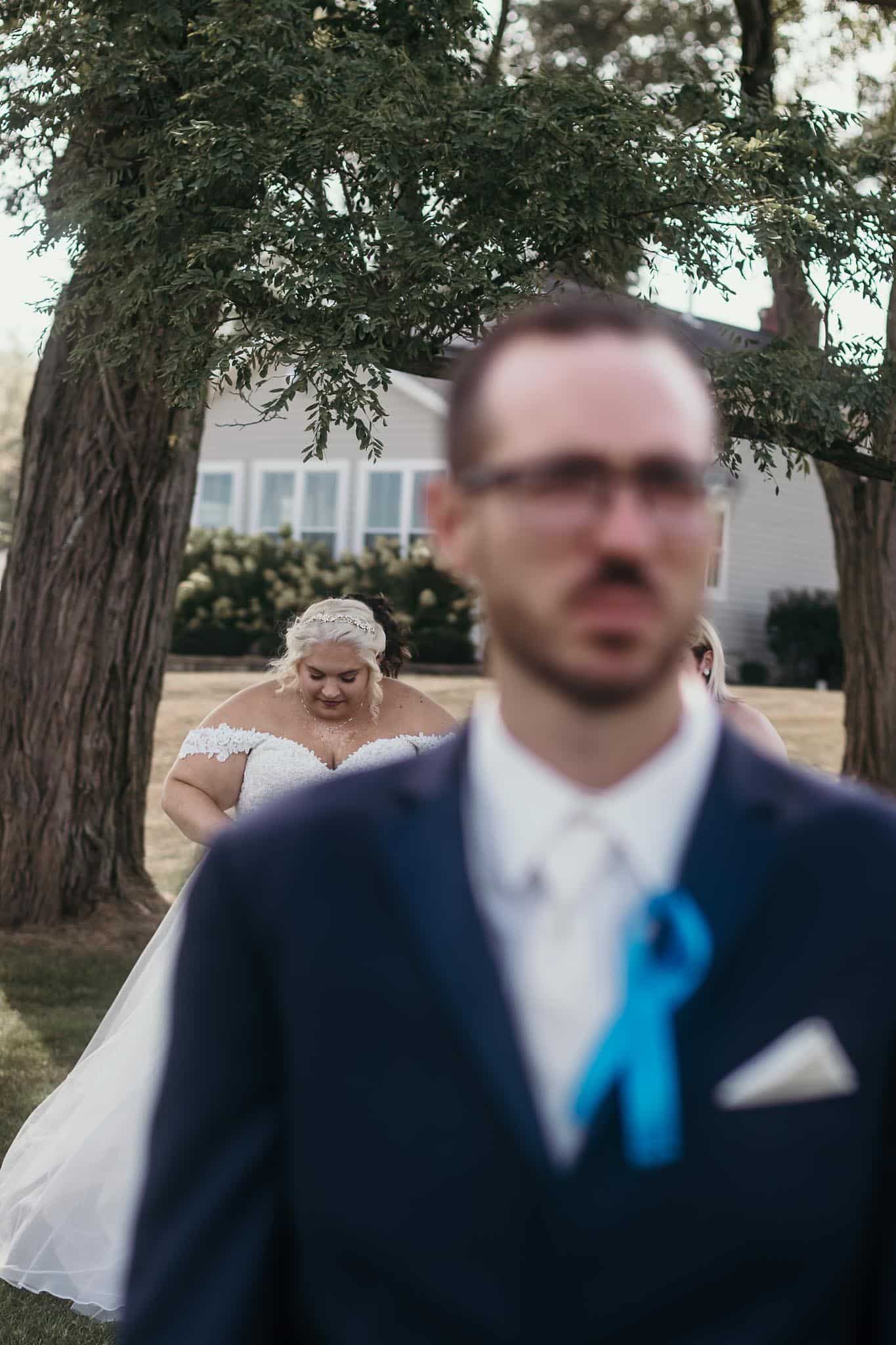 Groom waiting for bride before first look