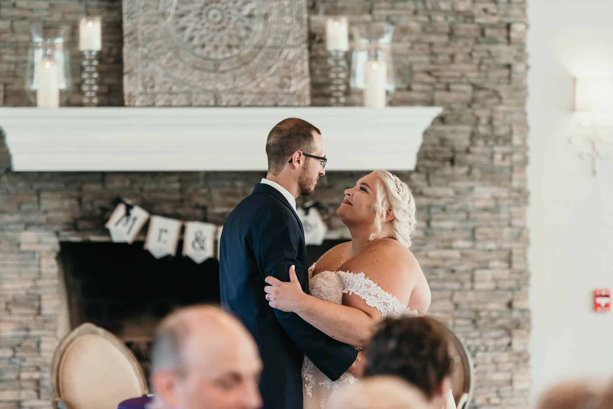 Bride and groom's first dance during reception at intimate fall wedding