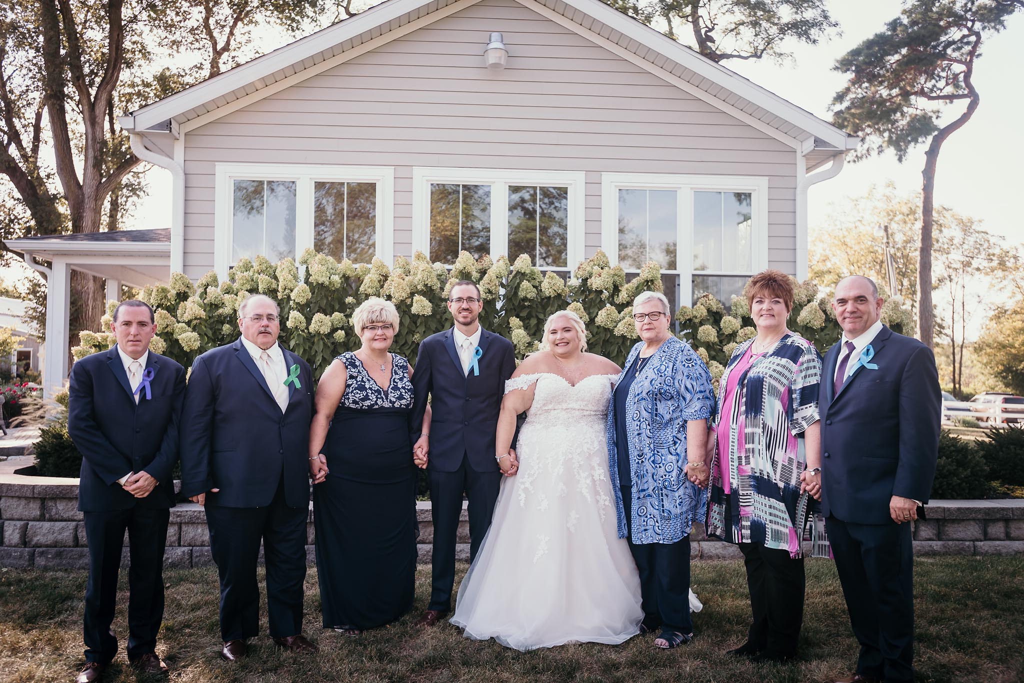 group family photo during outside intimate fall wedding at the Lodge at River Valley in Yorktown, Indiana