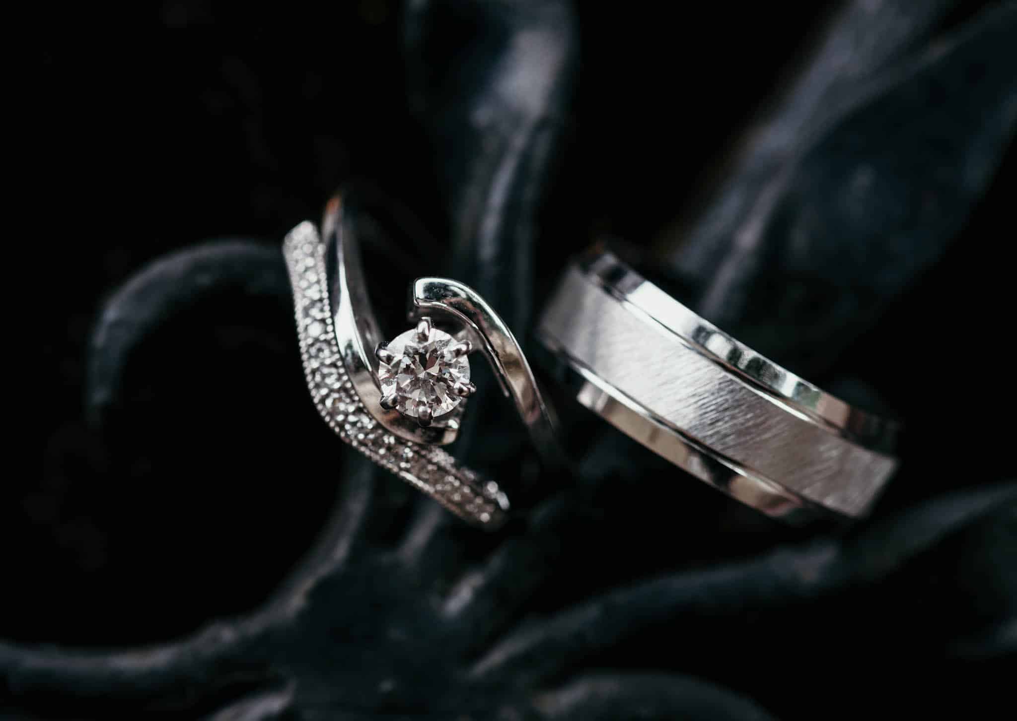 Up close shot of wedding ring details on wrought iron door