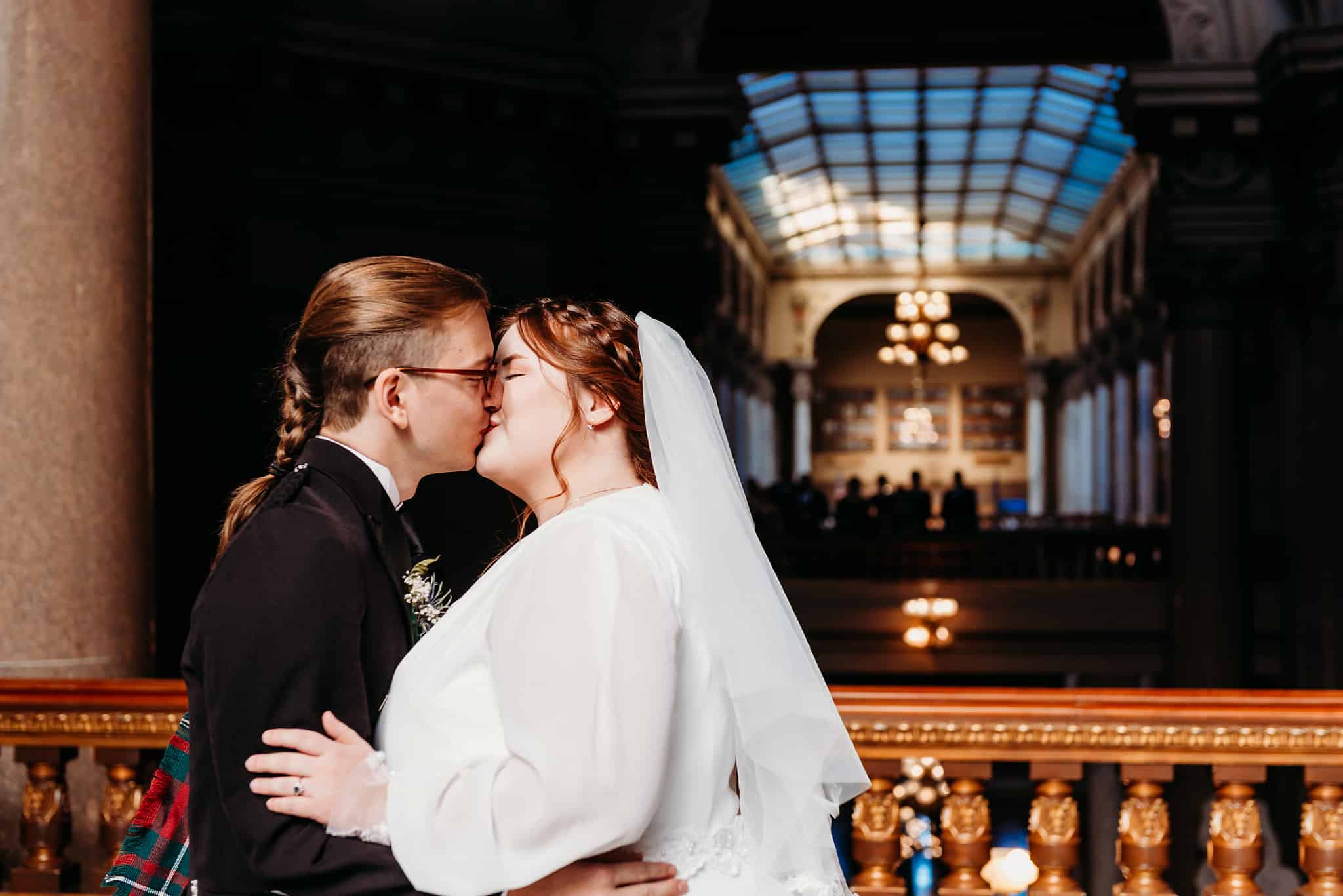 bride and groom kiss indiana state house wedding indianapolis