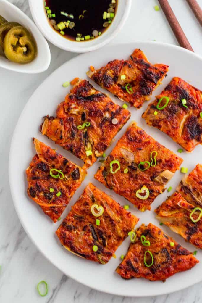 vegan Korean kimchi pancakes cut, over head shot